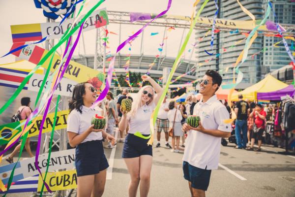 YVR Flight Crew members dancing with streamers around at Carnaval del Sol 2018