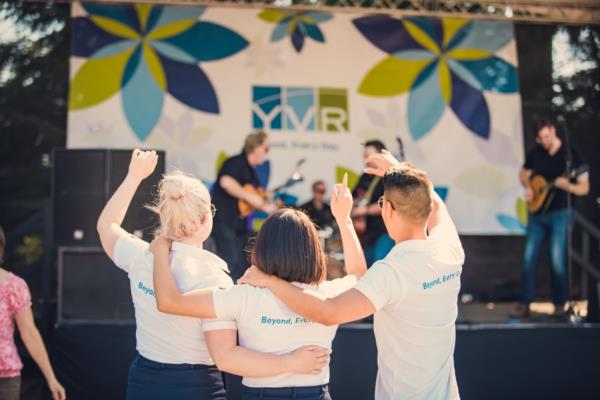 YVR team members enjoying live music in front of YVR stage at Fusion Festival 