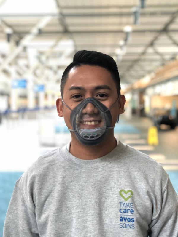 A man wears a prototype of a clear mask made to make mask wearing more accessible.