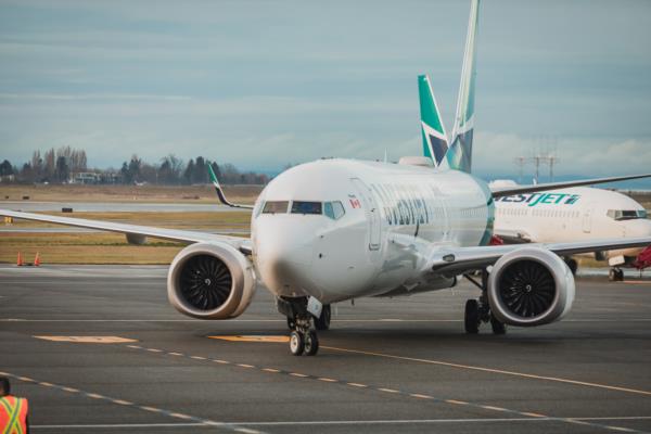 The WestJet Boeing 737 MAX taxis to the gate