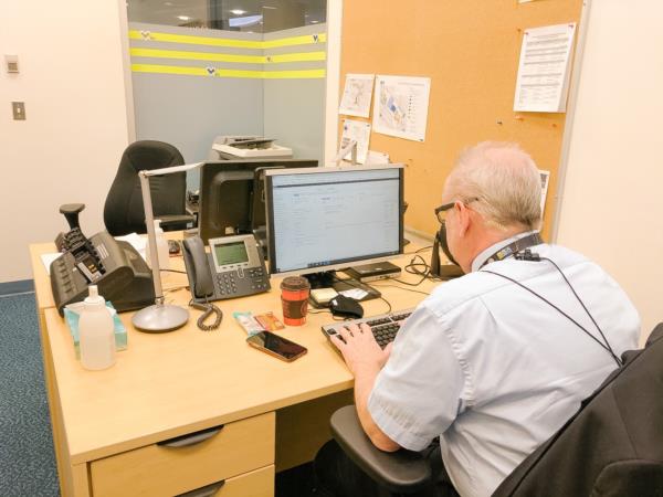 Dan sitting at his desk in the TDO office 