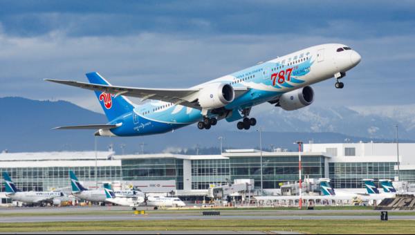 A China Southern Boeing 787 departing 08R as seen from the South Terminal Viewing Platform