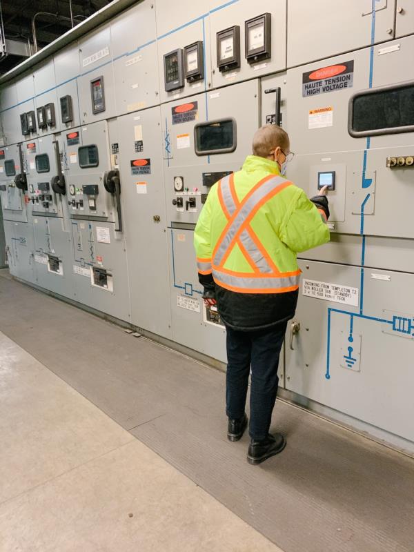 Robyn checks on an alarm in one of the electrical substations. 
