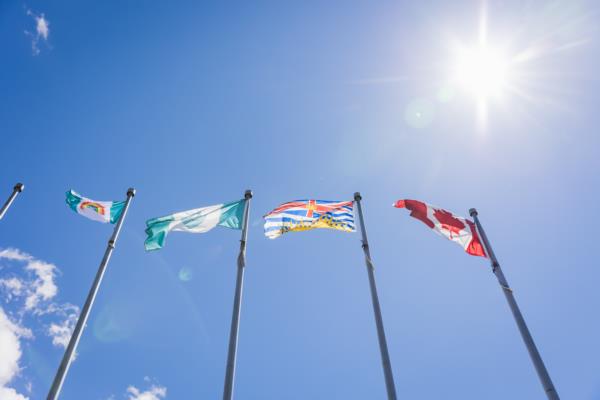 From left to right: Mack Paul's Coast Salish, Two-Spirit Pride flag, Musqueam flag, B.C. flag and the Canadian flag. 