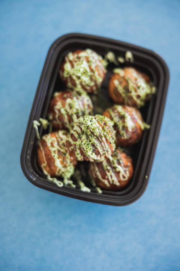 Takoyaki balls on blue backdrop