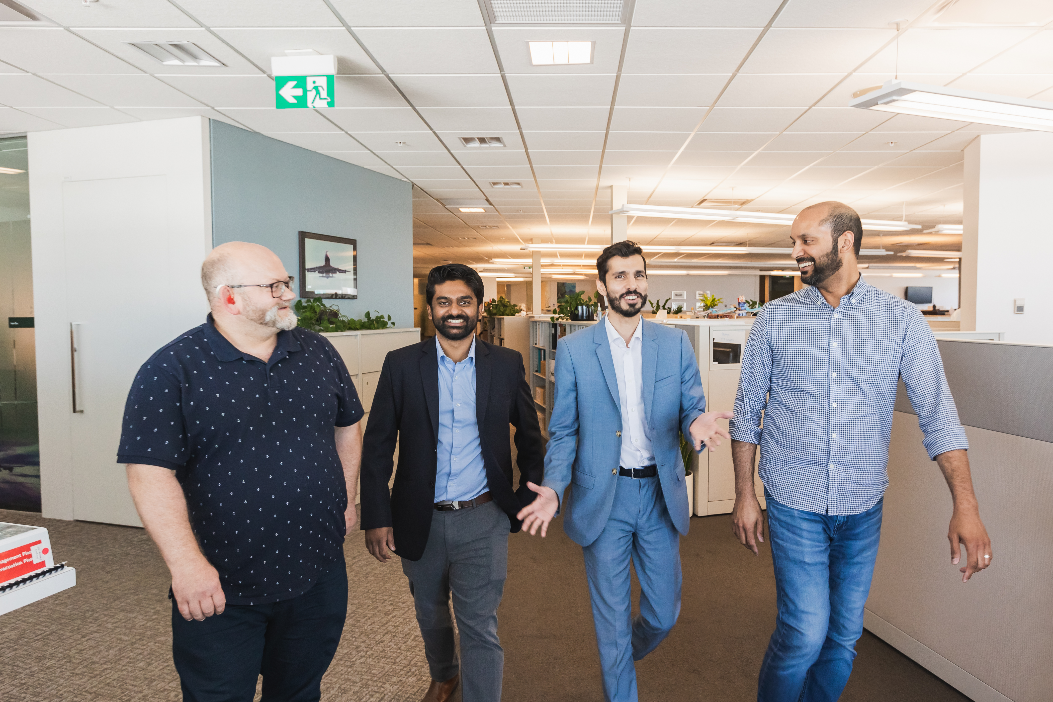 image of a group of yvr employees at the airport chatting